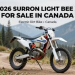 2025 Surron Ultra Bee electric dirt bike for sale in Canada on a scenic off-road trail